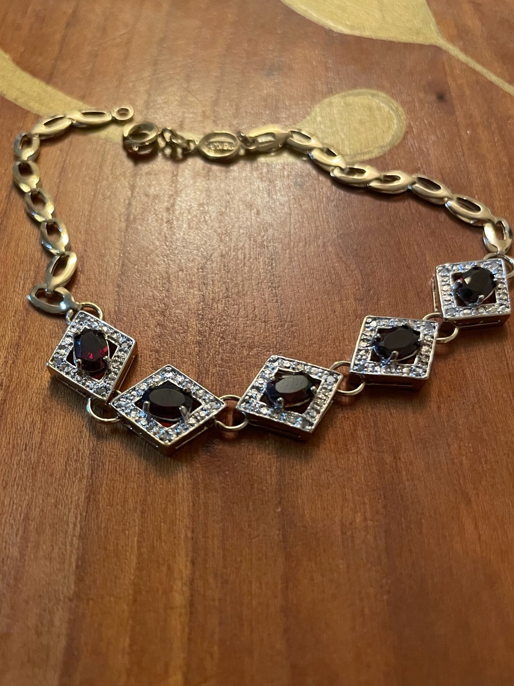 Gold-Tone Bracelet with Dark Red Gemstone Accents